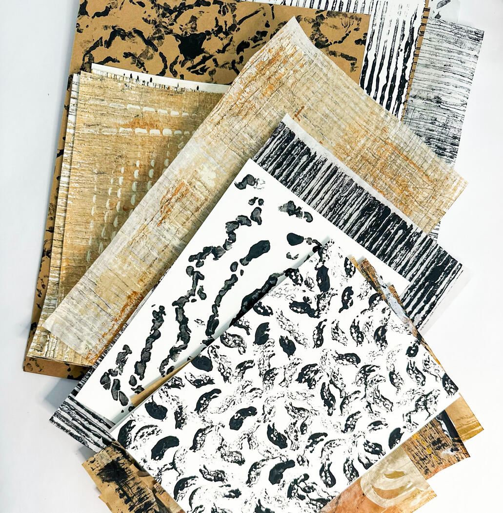 A collection of neutral coloured hand painted papers.